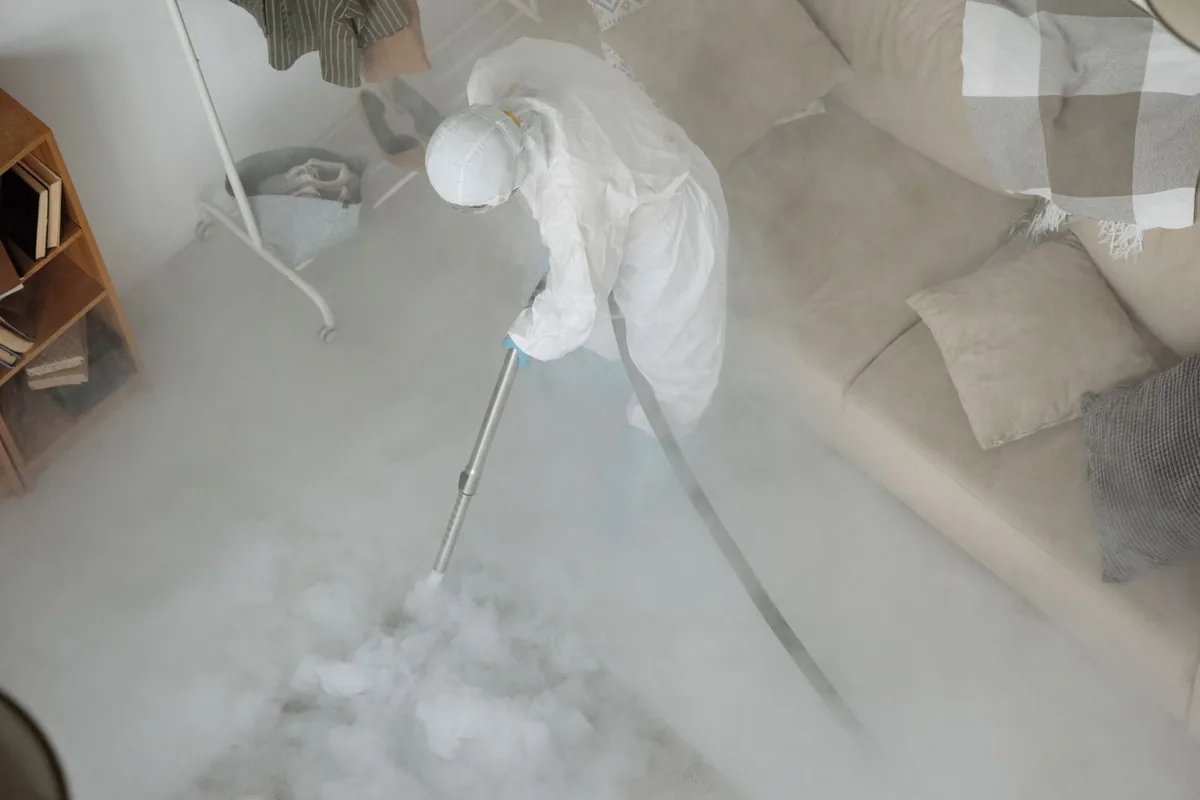 Biohazard cleanup technician in protective equipment, Springs, NY